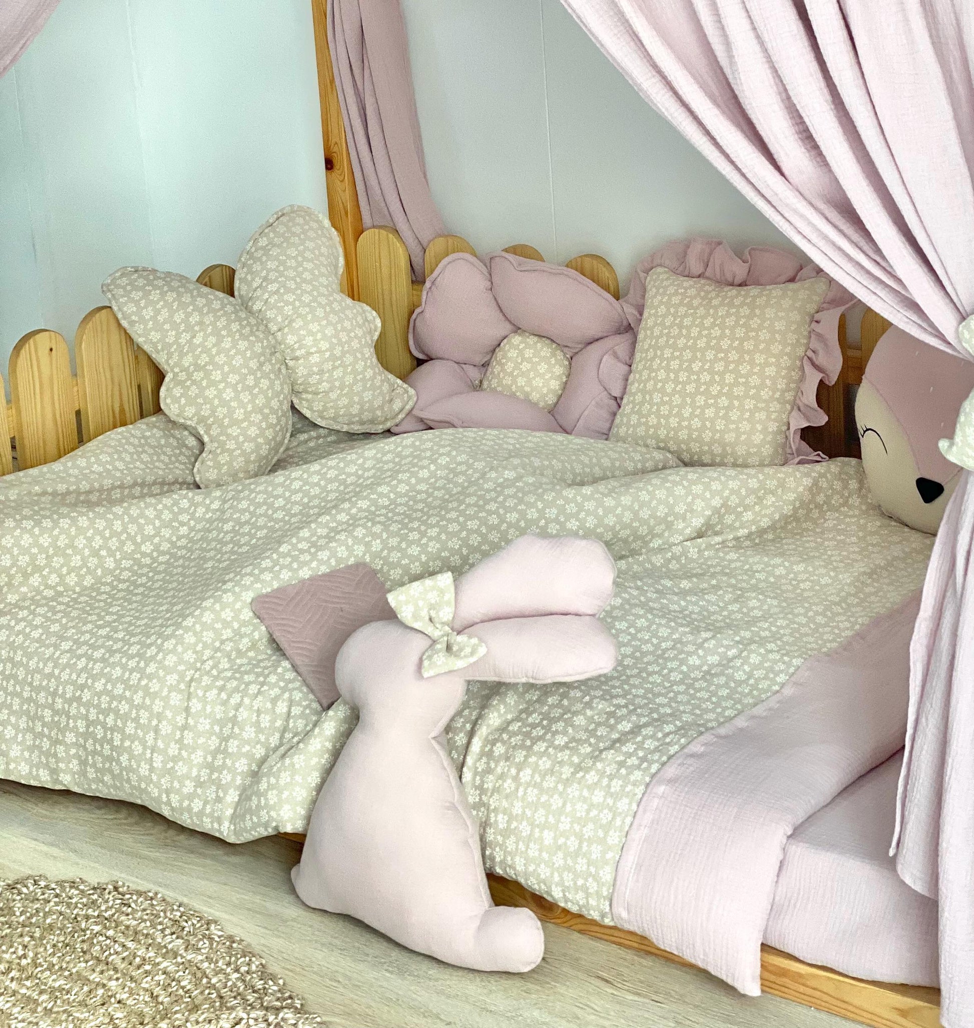 Handmade cotton muslin toddler duvet cover set with animal print styling on wooden Montessori kids bed