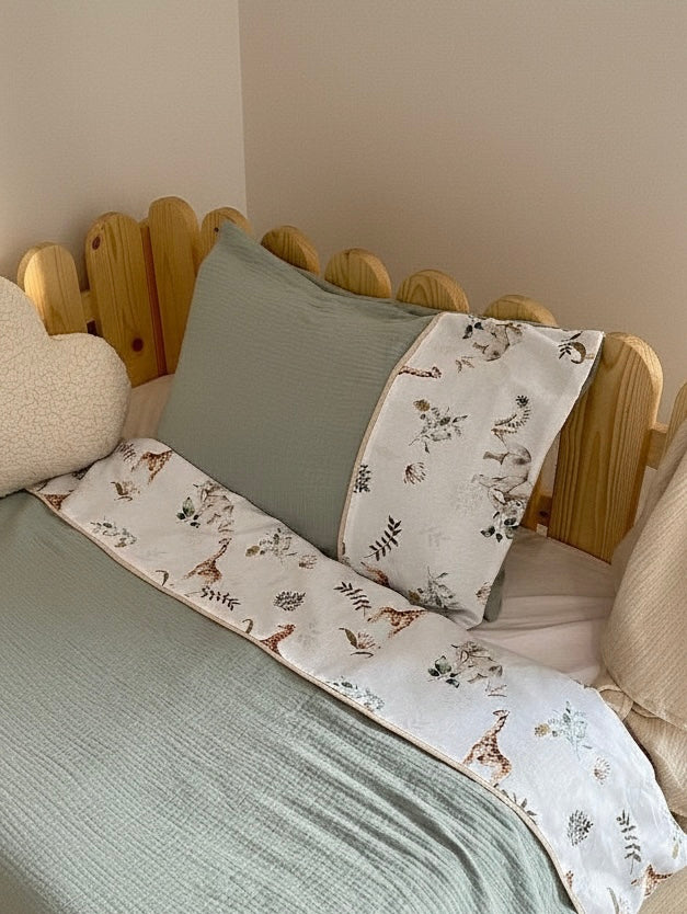 Handmade safari cotton muslin duvet cover set styled on wooden Montessori toddler bed
