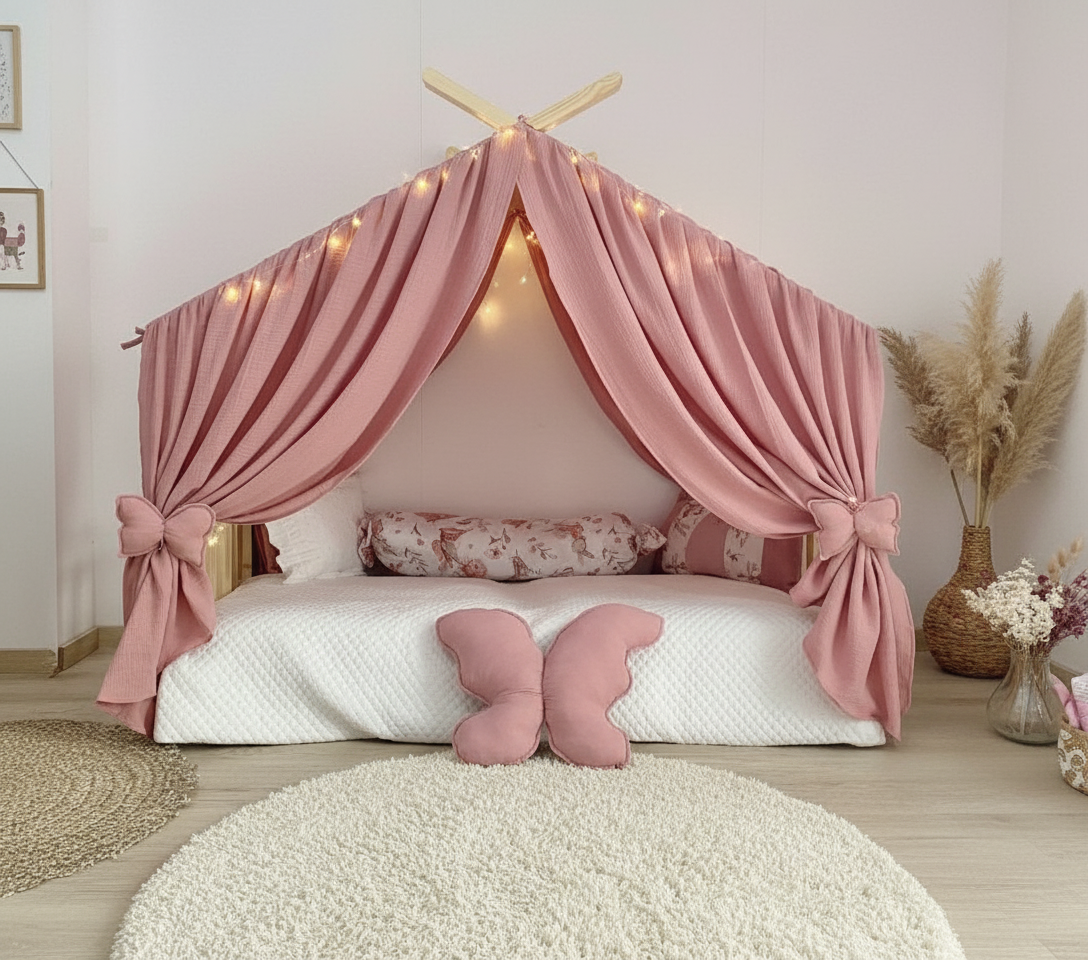 Blush pink canopy over Montessori floor bed