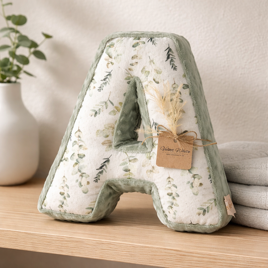 Personalized botanical letter A pillow in sage green for neutral nursery decor