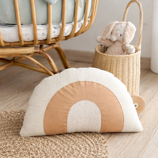 Neutral boho rainbow nursery pillow in beige and ivory tones