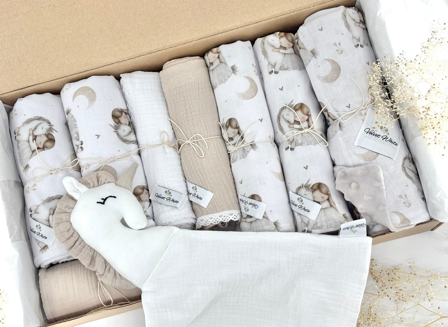Set of baby blankets with animal prints in a box